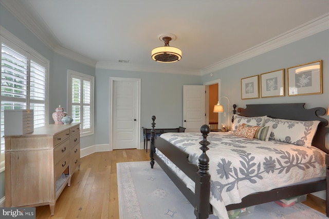 65 S College St, Carlisle, PA 17013 - bedroom with light wood finished floors, ornamental molding, and baseboards
