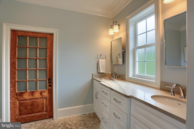 65 S College St, Carlisle, PA 17013 - bathroom featuring double vanity, ornamental molding, and baseboards