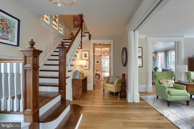 65 S College St, Carlisle, PA 17013 - staircase with a chandelier and hardwood / wood-style flooring