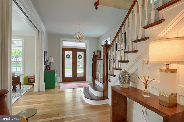 65 S College St, Carlisle, PA 17013 - foyer entrance featuring light wood-style floors, stairs, a chandelier, and french doors