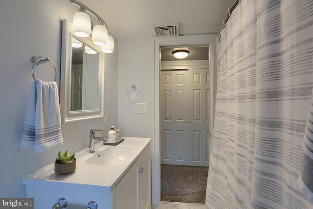 65 S College St, Carlisle, PA 17013 - bathroom with vanity and a shower with shower curtain