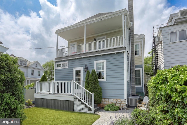 65 S College St, Carlisle, PA 17013 - rear view of house featuring a balcony, a yard, and central air condition unit