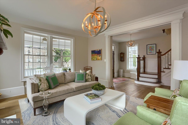 65 S College St, Carlisle, PA 17013 - living area with a chandelier, wood finished floors, stairway, and crown molding