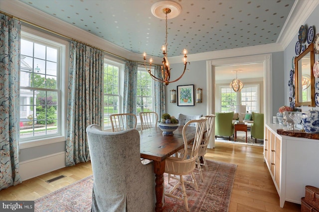 65 S College St, Carlisle, PA 17013 - dining space featuring a chandelier, ornamental molding, and light wood-type flooring