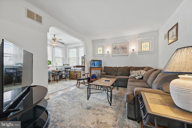 living room featuring a ceiling fan