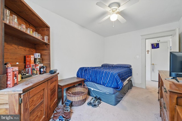 bedroom with light carpet and ceiling fan