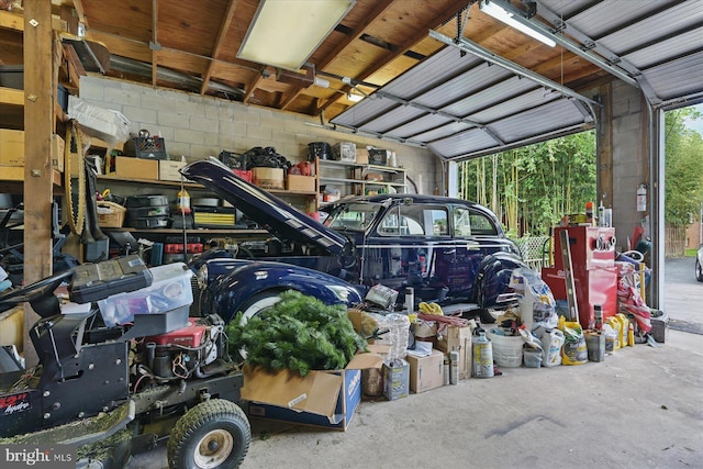 garage with concrete block wall