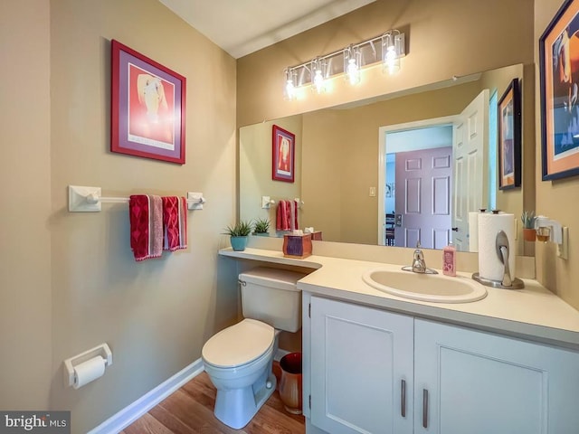 33 Laurel Cir, Newtown, PA 18940 - half bathroom featuring toilet, vanity, wood finished floors, and baseboards