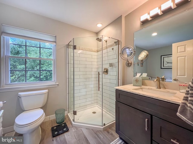 33 Laurel Cir, Newtown, PA 18940 - full bath featuring vanity, wood finished floors, toilet, a shower stall, and baseboards