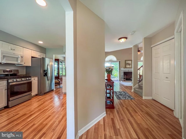 33 Laurel Cir, Newtown, PA 18940 - kitchen featuring appliances with stainless steel finishes, light wood finished floors, plenty of natural light, baseboards, and recessed lighting