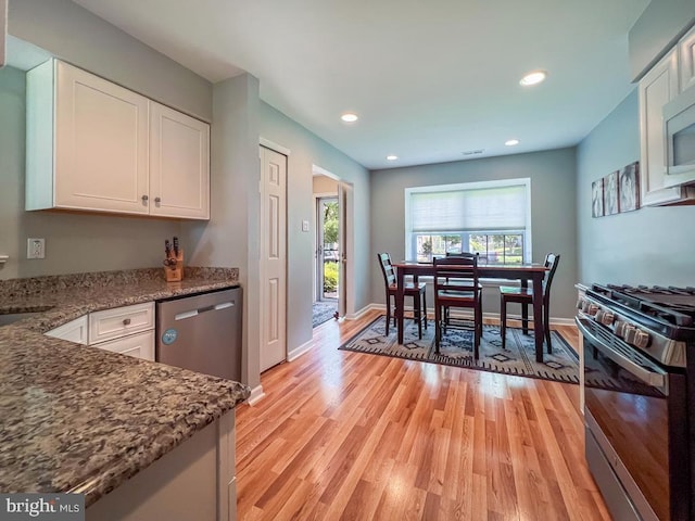 33 Laurel Cir, Newtown, PA 18940 - kitchen featuring appliances with stainless steel finishes, white cabinets, recessed lighting, light wood-style floors, and stone counters