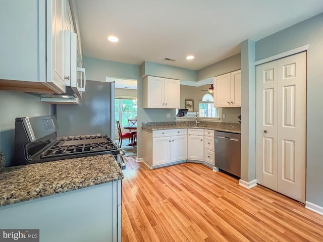 33 Laurel Cir, Newtown, PA 18940 - kitchen featuring stainless steel appliances, light wood-type flooring, white cabinetry, plenty of natural light, and recessed lighting