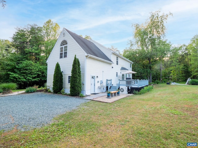 3919 Ruritan Lake Rd, Palmyra, VA 22963 - view of side of property with a deck, a patio area, and a yard