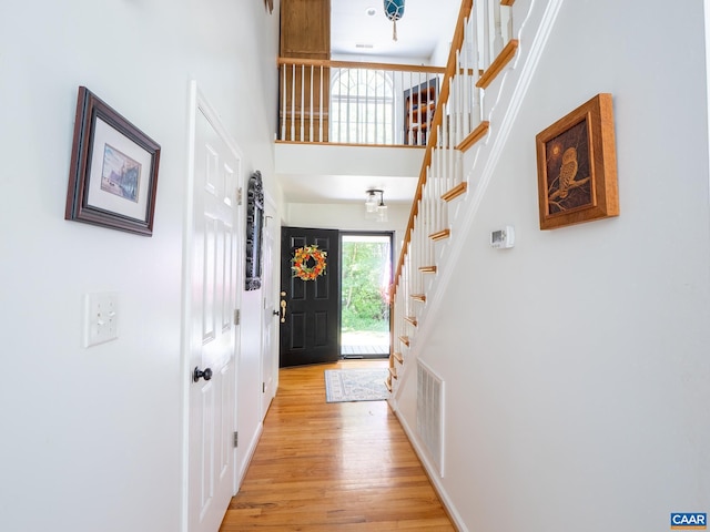 3919 Ruritan Lake Rd, Palmyra, VA 22963 - foyer with a high ceiling, light wood finished floors, stairway, and baseboards