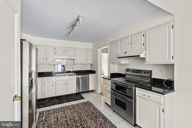 10699 Harding Rd, Laurel, MD 20723 - kitchen featuring appliances with stainless steel finishes, a sink, dark countertops, and ventilation hood
