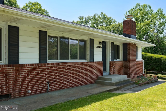 10699 Harding Rd, Laurel, MD 20723 - ranch-style home with a chimney and brick siding