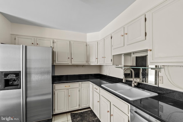 10699 Harding Rd, Laurel, MD 20723 - kitchen with stainless steel refrigerator with ice dispenser, a sink, dishwasher, dark countertops, and white cabinetry