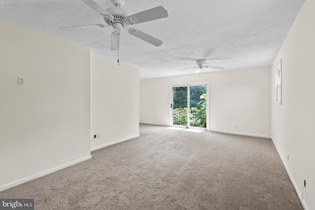 10699 Harding Rd, Laurel, MD 20723 - empty room featuring a textured ceiling, ceiling fan, carpet flooring, and baseboards