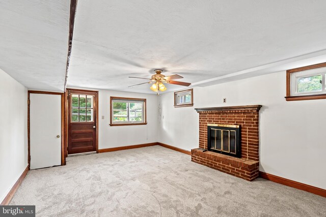 10699 Harding Rd, Laurel, MD 20723 - unfurnished living room with a fireplace, baseboards, ceiling fan, and carpet
