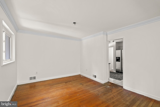 10699 Harding Rd, Laurel, MD 20723 - empty room with wood-type flooring, crown molding, baseboards, and a pendent fire sprinkler