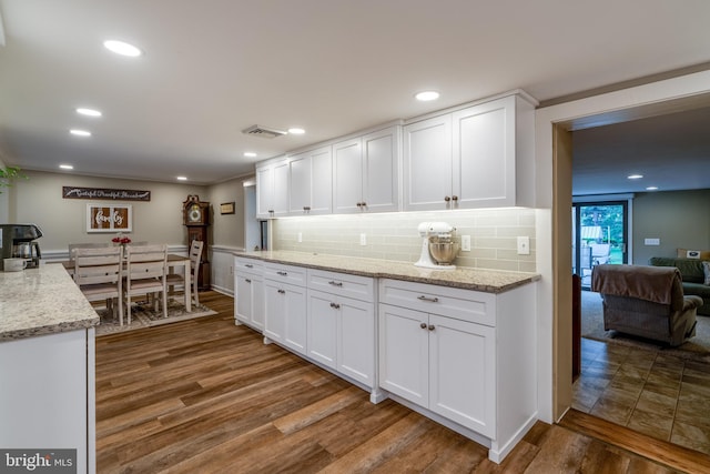 1626 Lampeter Rd, Lancaster, PA 17602 - kitchen with wood finished floors, white cabinetry, tasteful backsplash, and recessed lighting