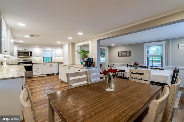 1626 Lampeter Rd, Lancaster, PA 17602 - dining area featuring light wood-style flooring, ornamental molding, and recessed lighting