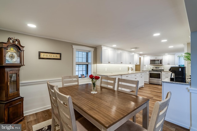 1626 Lampeter Rd, Lancaster, PA 17602 - dining area with wood finished floors, recessed lighting, ornamental molding, and wainscoting