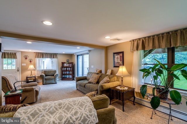 1626 Lampeter Rd, Lancaster, PA 17602 - living area featuring light carpet, healthy amount of natural light, recessed lighting, and a baseboard heating unit