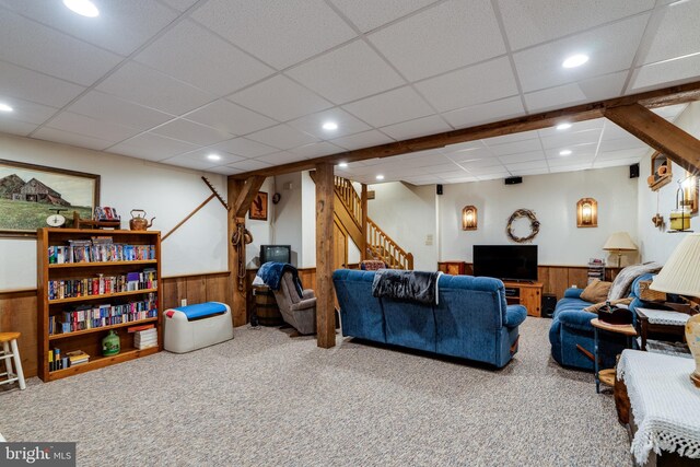 1626 Lampeter Rd, Lancaster, PA 17602 - living area with carpet floors, wood walls, wainscoting, stairway, and a drop ceiling