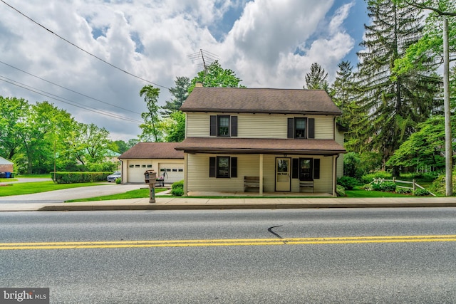1626 Lampeter Rd, Lancaster, PA 17602 - view of front facade featuring concrete driveway, an attached garage, and covered porch
