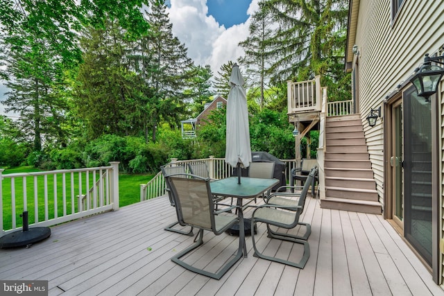 1626 Lampeter Rd, Lancaster, PA 17602 - wooden terrace with outdoor dining area, stairs, a yard, and view of scattered trees