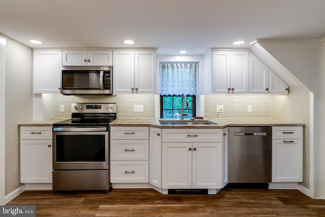 1626 Lampeter Rd, Lancaster, PA 17602 - kitchen with appliances with stainless steel finishes, a sink, white cabinetry, tasteful backsplash, and recessed lighting