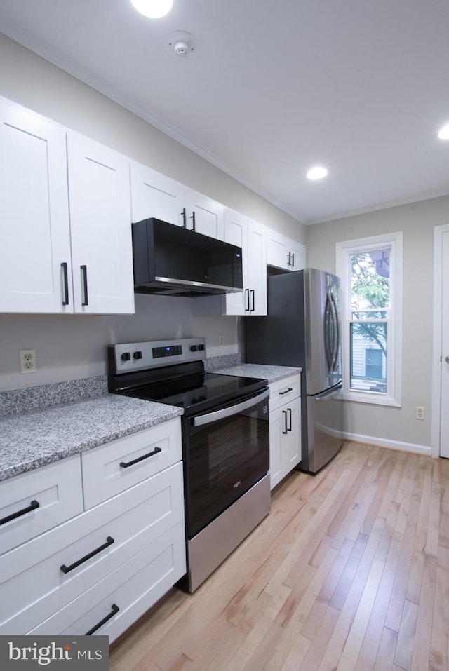 243 Loudoun St SW Unit F, Leesburg, VA 20175 - kitchen featuring stainless steel range with electric stovetop, white cabinetry, light wood-type flooring, light stone counters, and recessed lighting