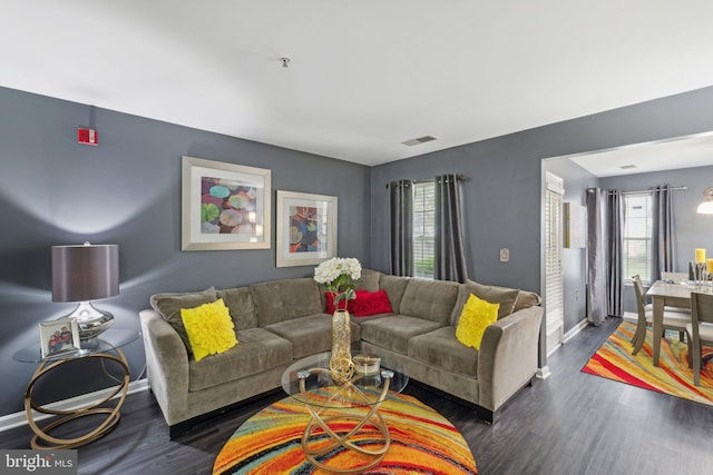 15609 Everglade Ln Unit F002, Bowie, MD 20716 - living room featuring dark wood-style floors and baseboards