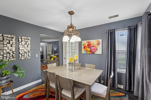 15609 Everglade Ln Unit F002, Bowie, MD 20716 - dining area featuring wood finished floors, plenty of natural light, a chandelier, and baseboards