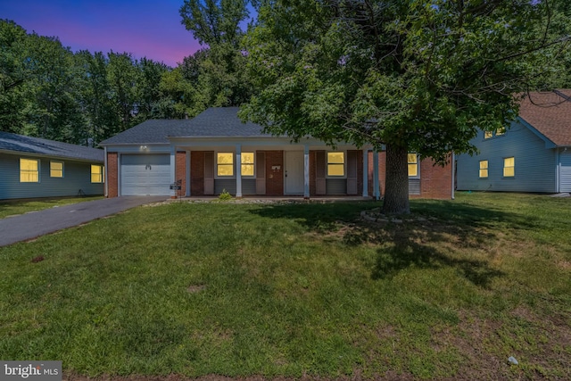 20 Executive Ln, Willingboro, NJ 08046 - ranch-style house with brick siding, driveway, a garage, a porch, and a front lawn