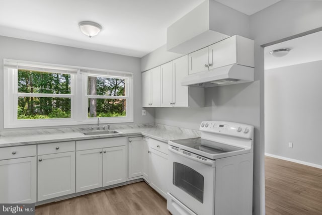 20 Executive Ln, Willingboro, NJ 08046 - kitchen with white electric range oven, under cabinet range hood, a sink, and plenty of natural light