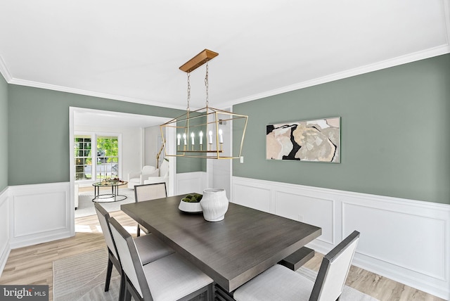 2619 Stone Mountain Ct, Herndon, VA 20170 - dining room with ornamental molding, light wood finished floors, a wainscoted wall, a chandelier, and a decorative wall