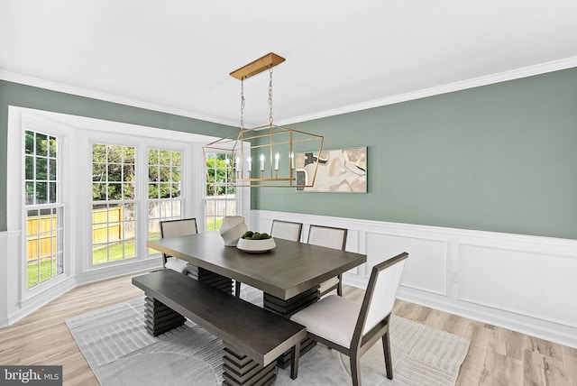 2619 Stone Mountain Ct, Herndon, VA 20170 - dining area with ornamental molding, light wood-style floors, a wainscoted wall, a chandelier, and a decorative wall