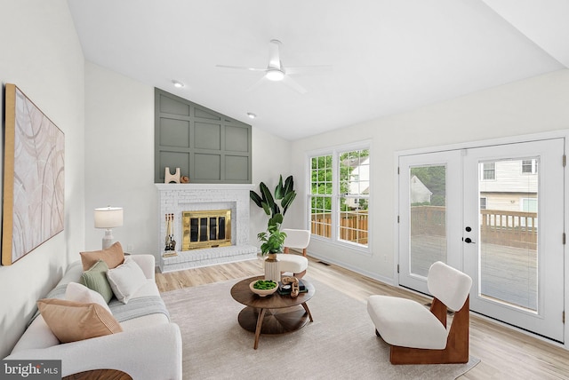 2619 Stone Mountain Ct, Herndon, VA 20170 - living area featuring light wood finished floors, lofted ceiling, ceiling fan, and a fireplace