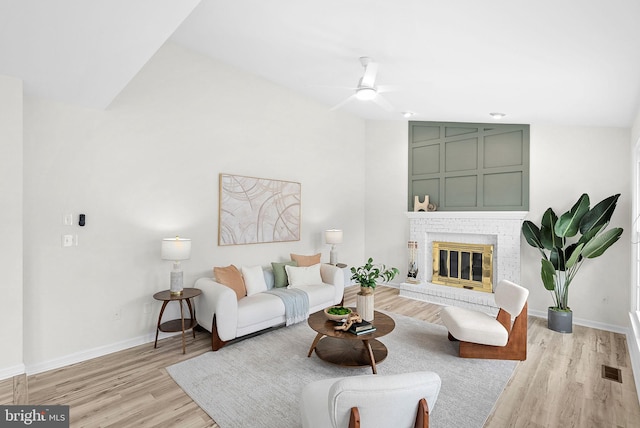 2619 Stone Mountain Ct, Herndon, VA 20170 - living room with light wood-type flooring, a ceiling fan, lofted ceiling, baseboards, and a fireplace