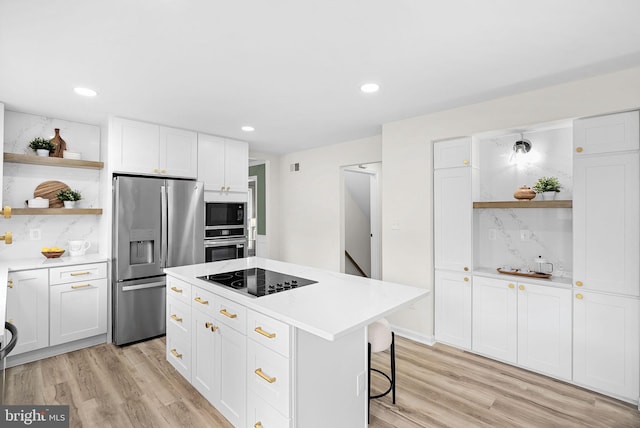 2619 Stone Mountain Ct, Herndon, VA 20170 - kitchen with open shelves, appliances with stainless steel finishes, white cabinetry, light wood-type flooring, and recessed lighting