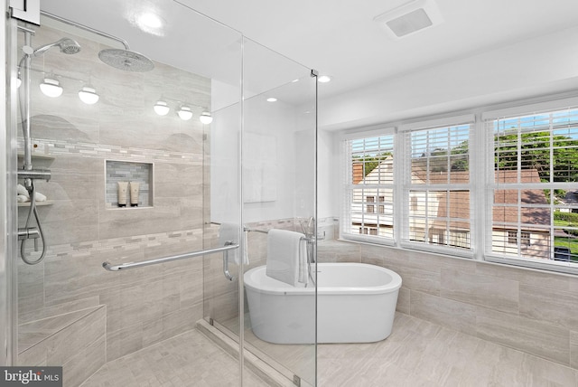 2619 Stone Mountain Ct, Herndon, VA 20170 - bathroom with a shower stall, tile walls, a soaking tub, and recessed lighting