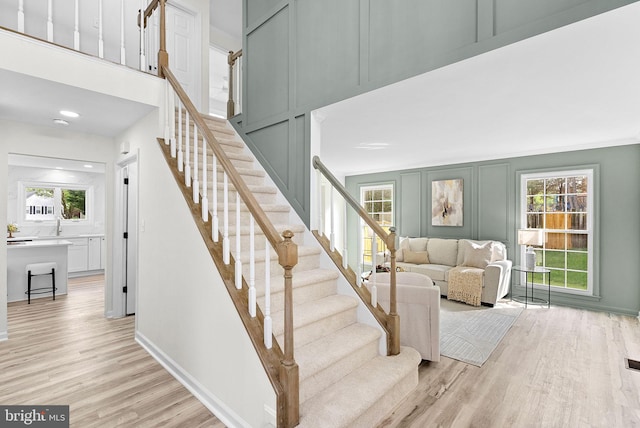 2619 Stone Mountain Ct, Herndon, VA 20170 - stairs with wood finished floors, a decorative wall, baseboards, and recessed lighting