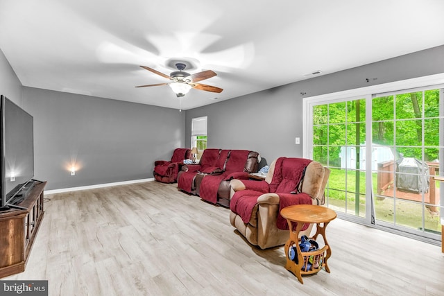 8328 Ridge View Rd, Lusby, MD 20657 - home theater room with wood finished floors, a ceiling fan, and baseboards