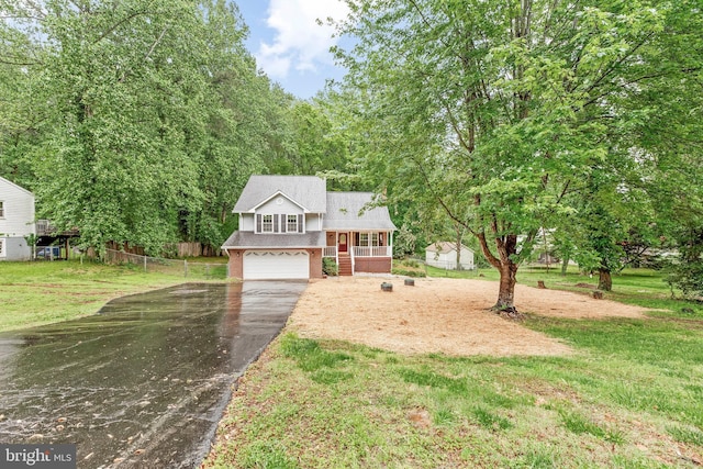 8328 Ridge View Rd, Lusby, MD 20657 - split level home with driveway, an attached garage, brick siding, a shingled roof, and covered porch