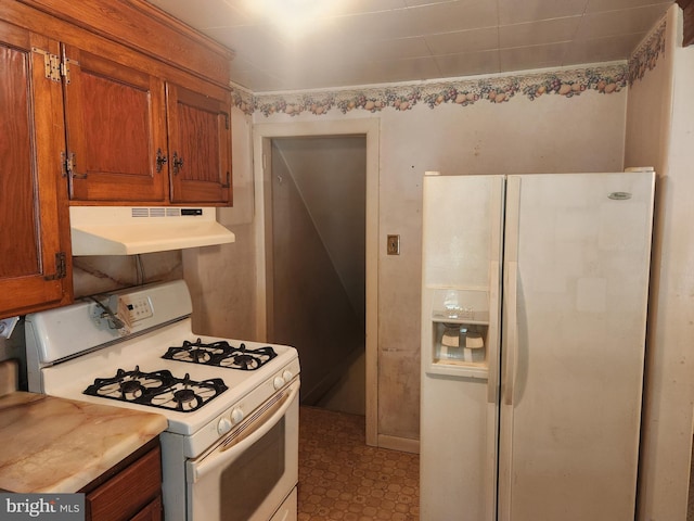 841 Highland Ave, Lancaster, PA 17603 - kitchen featuring white appliances, under cabinet range hood, brown cabinetry, and light countertops