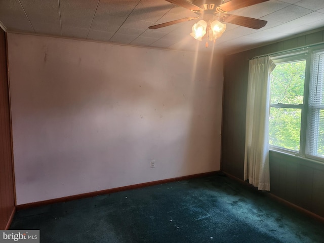841 Highland Ave, Lancaster, PA 17603 - spare room with dark colored carpet, a ceiling fan, and baseboards