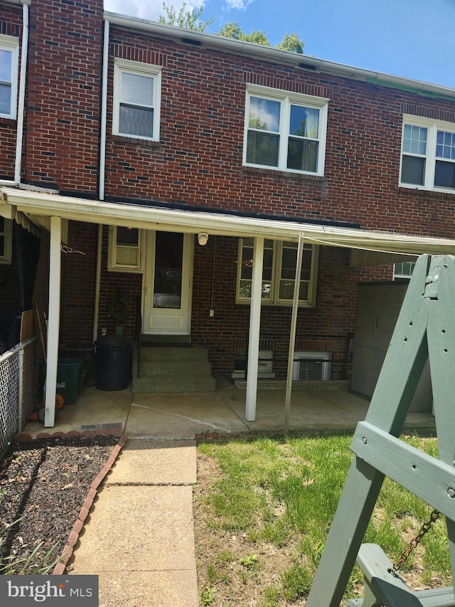 841 Highland Ave, Lancaster, PA 17603 - view of front facade with brick siding and a patio area