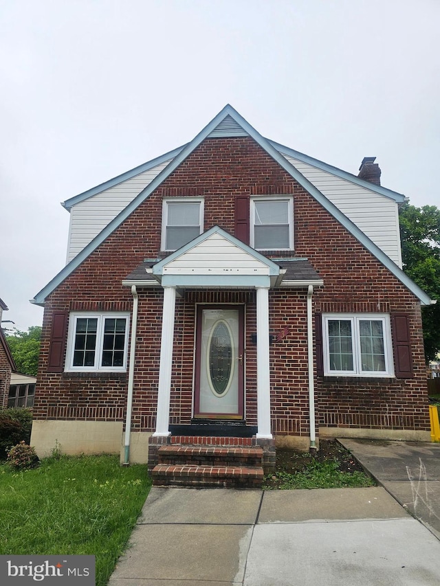 3 W Elm Ave, Baltimore, MD 21206 - view of front of home featuring brick siding and a chimney
